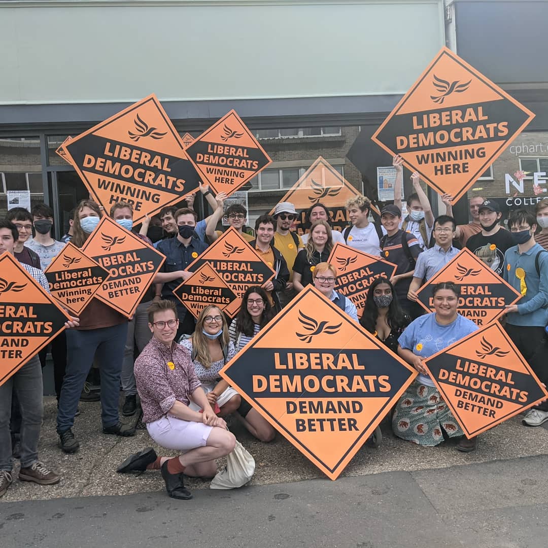 Young Liberals at the Chesham and Amersham by-election, posing for a group photo and holding large Lib Dem diamonds