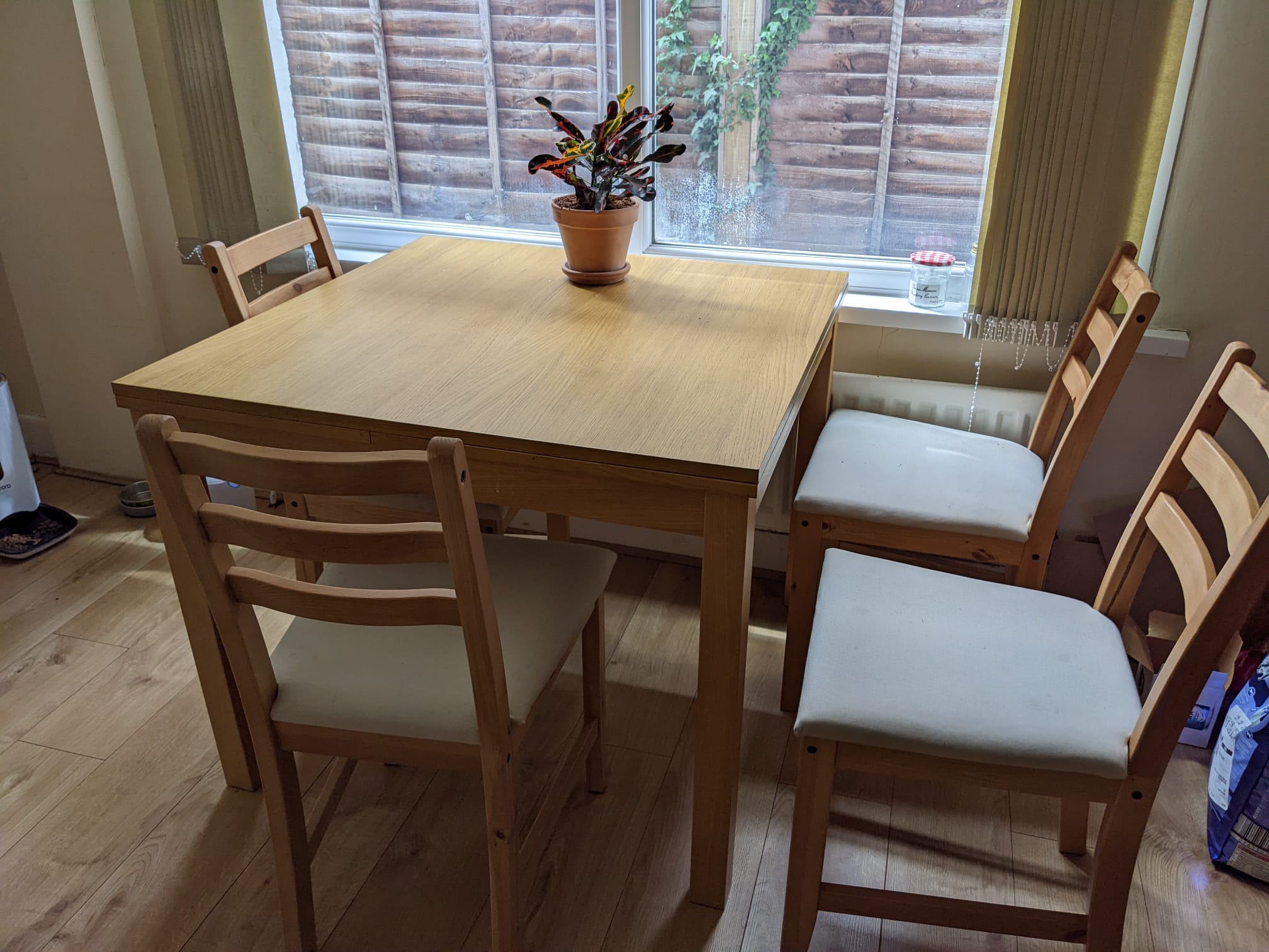 Wood dining table with four chairs