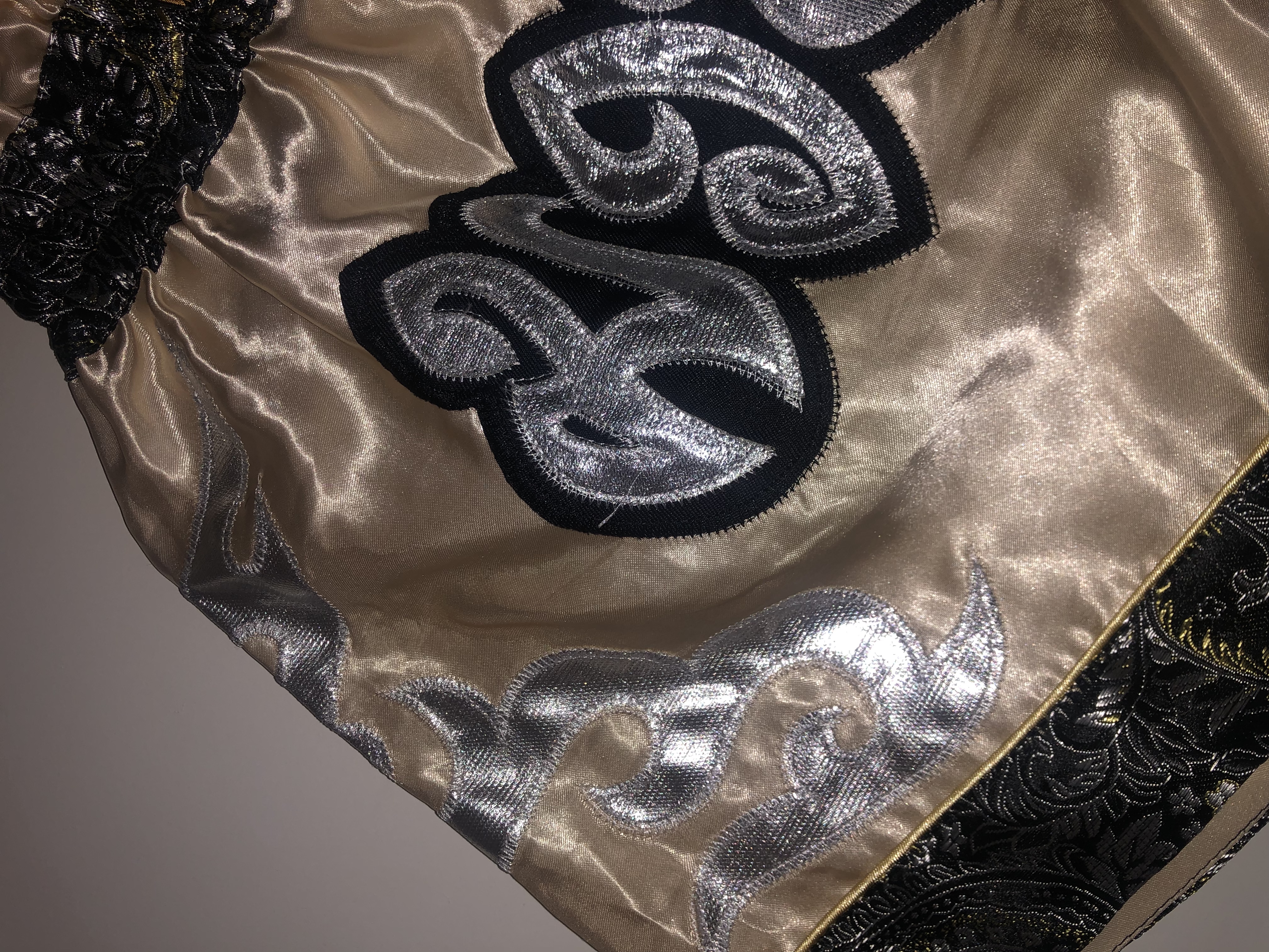 Close up of gold and cream shorts