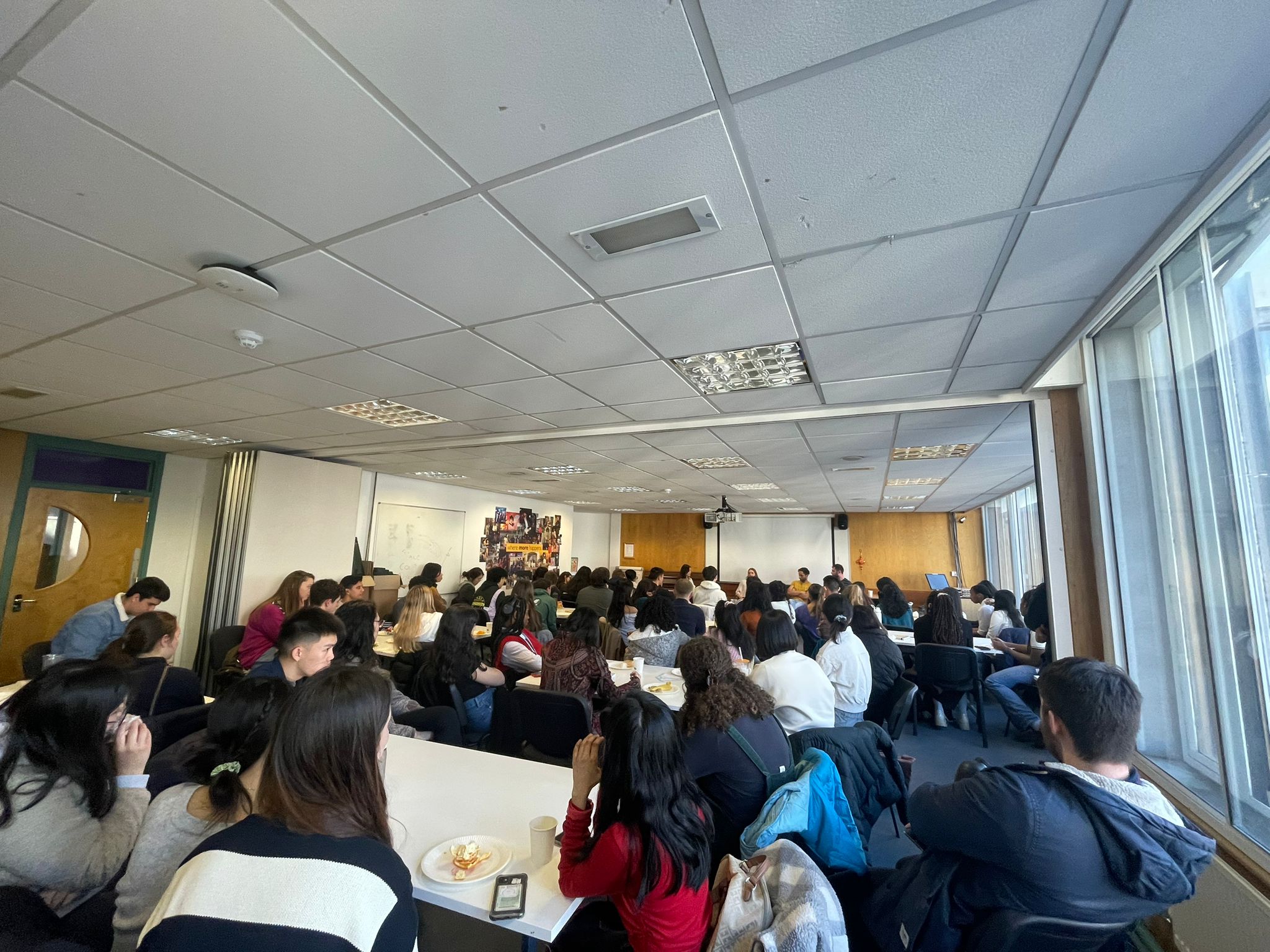 Room filled with people at a CU event
