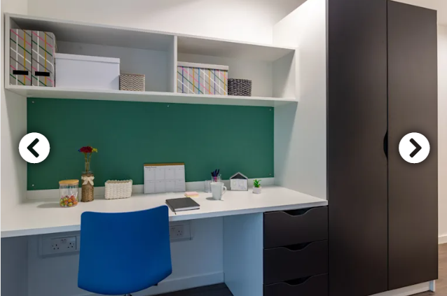 Picture of desk, storage space, and wardrobe