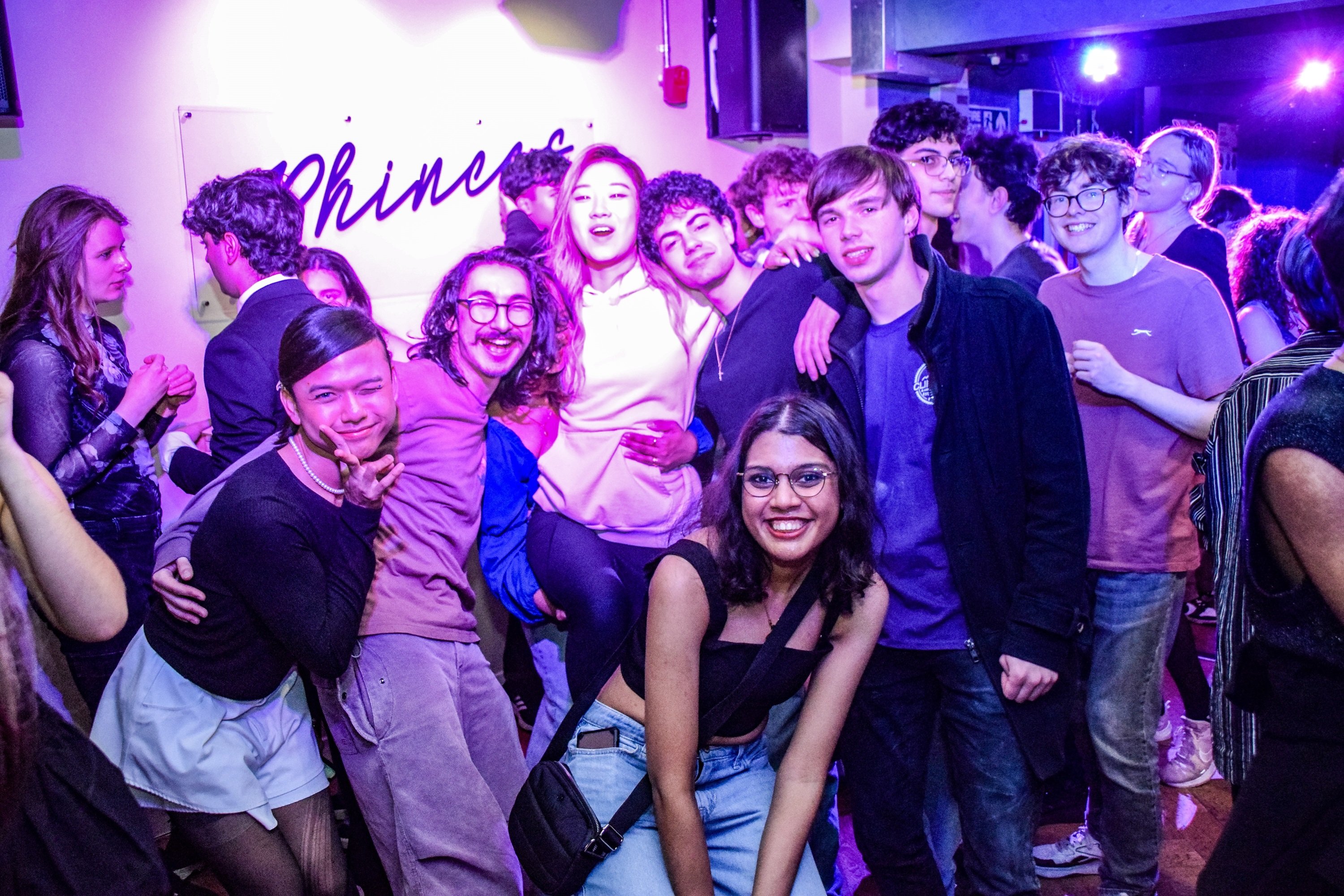 Group of students all smiling and posing for camera in Phineas