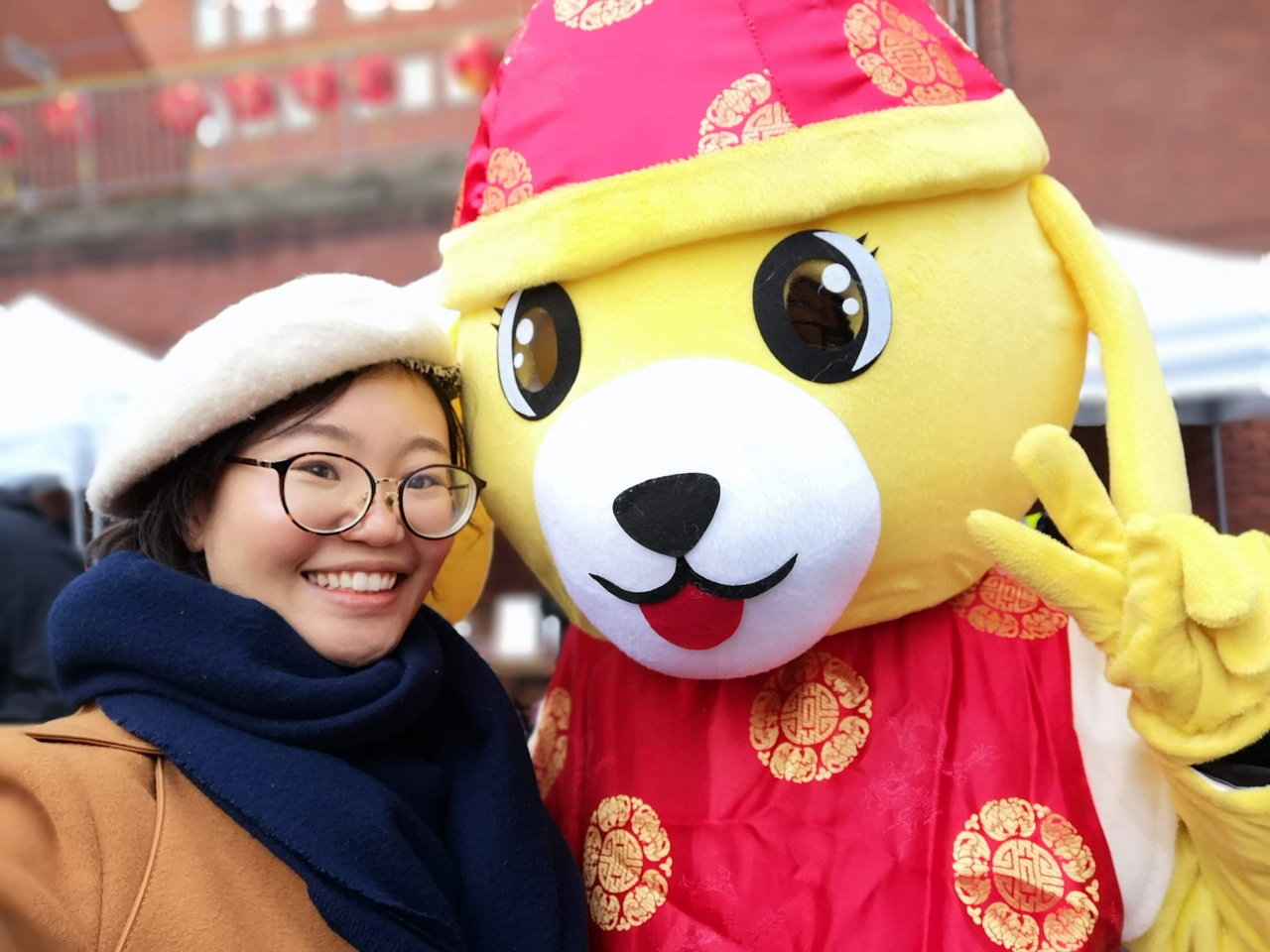 Woman stood next to volunteer in giant dog costume