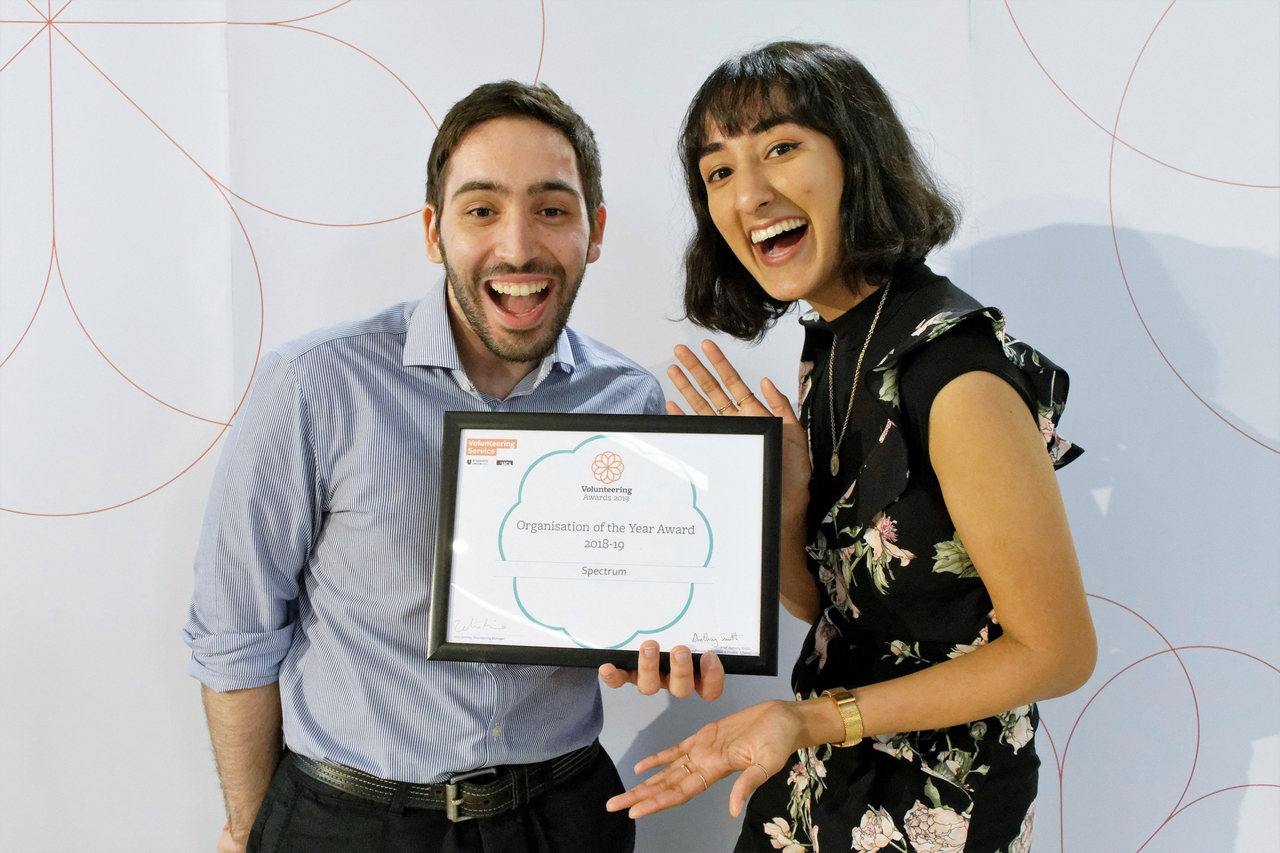 two students from Spectrum with their award
