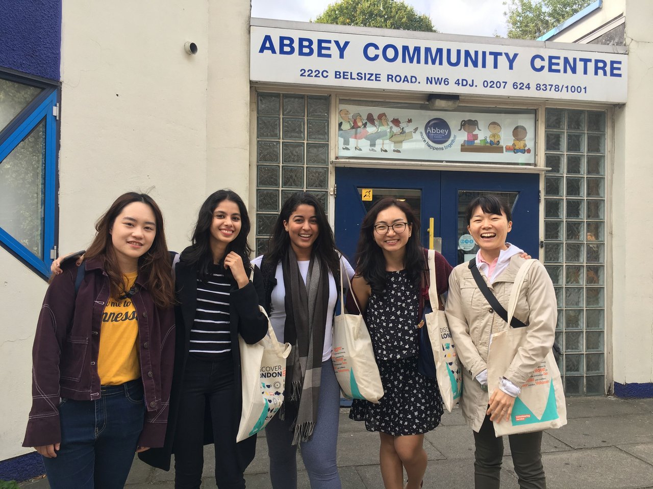 Group of female students standing outside Abbey Community Centre